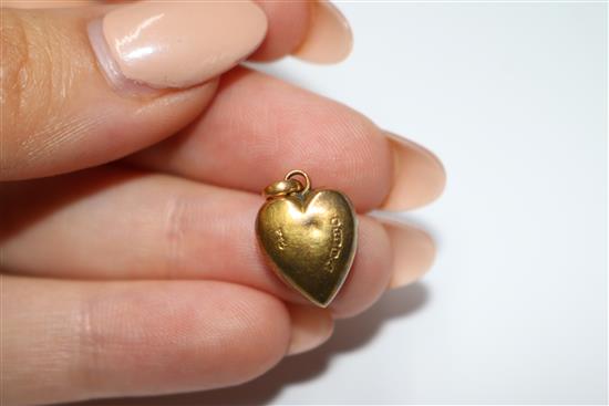 An Edwardian gold openwork pendant set amethyst and pearl, a peridot set pendant and a 15ct gold and turquoise heart pendant